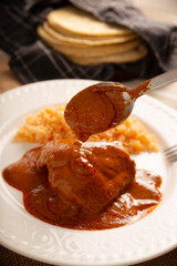 Pipian with Chicken, food from Mexico and other Latin American countries, chicken meat bathed in mole sauce made with pumpkin seeds, dried chili peppers and several other ingredients.