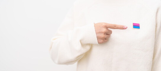 Bisexuality Celebrate Day and LGBT pride month, LGBTQ or LGBTQIA concept. Hand holding purple, pink and blue flag shape for Lesbian, Gay, Bisexual, Transgender, Queer, Pansexual, Marriage Equality Law