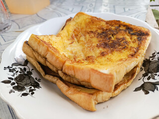 Golden French Toast Stack on Decorative Plate Ready to Eat