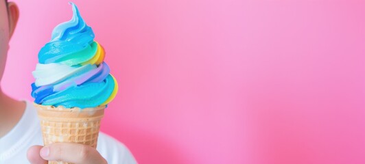 Rainbow Ice Cream Cone on Pink Background