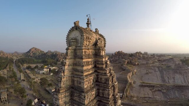 Gopura Towers of Hampi - Vijayanagara Empire Heritage.  Magnificent drone footage of Hampi iconic gopuram towers, showcasing ancient South Indian temple architecture.