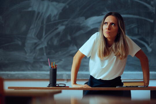 Angry Teacher Getting up from her Chair Looking Around.  Frustrated professor feeling indignant promoting discipline in class