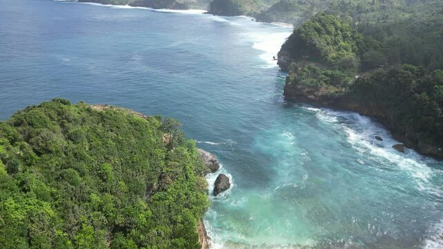 a row of beaches with big waves in south malang