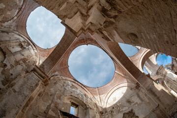 Photograph of ancient ruins of Antigua Guatemala without a roof, with historic architectural details in an open environment.