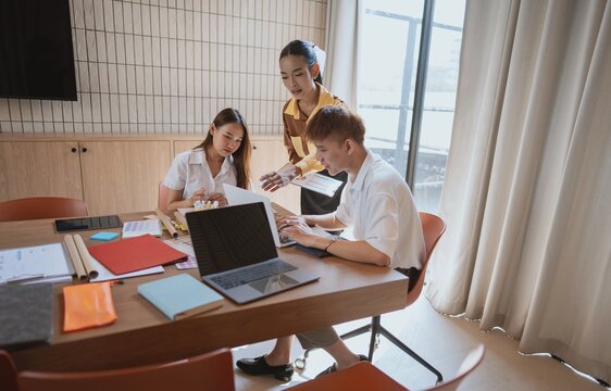 group of business people LGBTQ+ Diverse Team meeting collaborating new project in office - Powered by Adobe