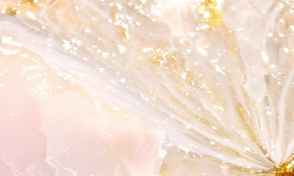 Close-up of soft pink marble resembling rose quartz, delicate white and gold veins spreading like flower petals