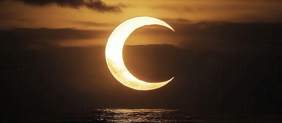 Golden Crescent Sun Eclipse Over Ocean Horizon