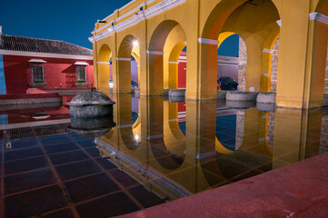 Colonial arches of Tanque La Union in Antigua Guatemala at night