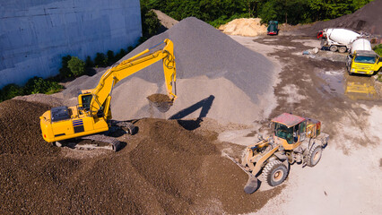 a working excavator, moving rubble