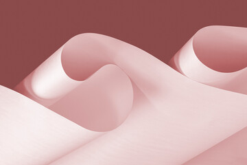 Pink sheets of paper as a background for creative design tasks.