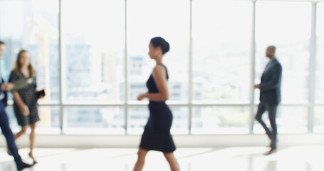 Blur, moving and walking with business people in lobby of office for corporate productivity. Busy,...
