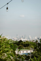 Stunning cityscape of the skyline of Manila outdoor at daytime on a hazy morning on the roof of a hotel during a holiday in the Philippines in South East Asia with space for text.