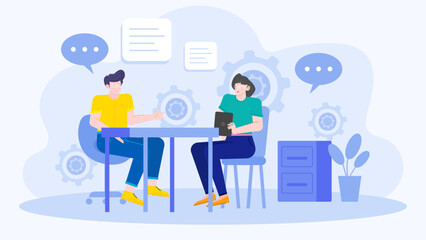 Two people sit at a desk discussing work. Great for business meetings, teamwork concepts, collaboration, office scenes, and project planning.