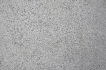 Detailed gray concrete wall. Rough texture, neutral tones, perfect for backgrounds, architectural visualizations, and graphic design projects. Versatile for various uses.