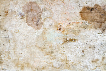 Old cardboard with stains and scratches. The texture of antique yellowed paper.