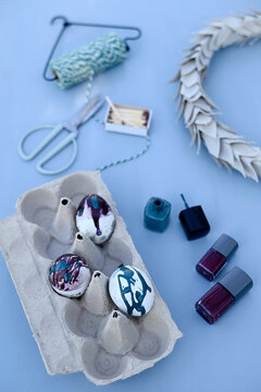 DIY Easter egg decoration with nail polish and wreath in a studio in Hamburg