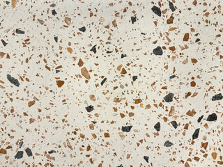 Close up of white terrazzo granite tiles with colorful small gravels texture. Terrazzo is increasingly being used in contemporary edgy and stylish interior as wall or floor finishing.