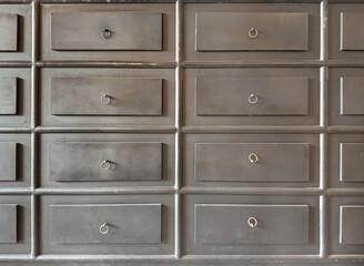 Close up of dark brown rustic wood drawers. Carpentry works, cabinet furniture concept. Dark grey...
