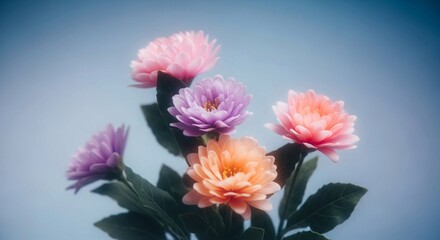 Colorful floral arrangement featuring soft pastel flowers and green leaves on a bright blue studio background.
