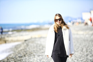 girl in sunglasses beach winter cold vacation freedom mediterranean sea