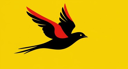 Naklejka premium A black and red bird flying in the air