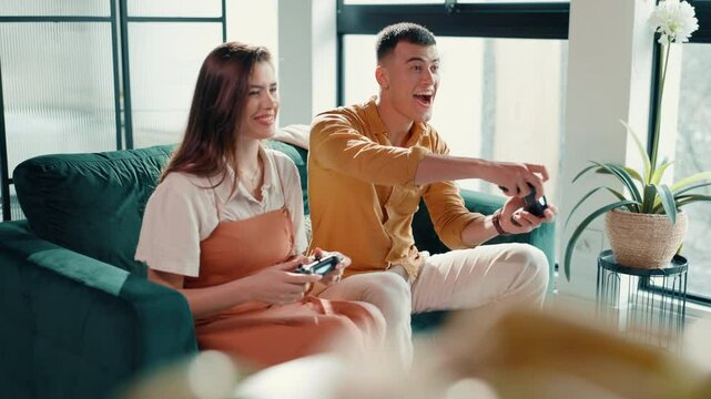 Bonding, couple and cheating on game, controller and fun with virtual sport, happy or entertainment. Laughing, man and woman with console for digital competition, gamer or playing with tech in house