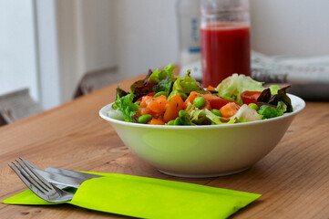 Colorful salmon salad bowl with fresh greens and edamame