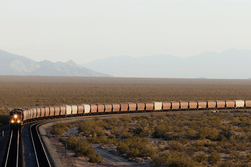 Distant desert landscape view of train