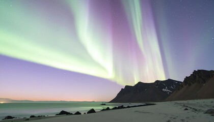 Vivid Aurora Borealis Display Over Coastal Landscape Featuring Purple And Green Lights In A Starry Night Sky
