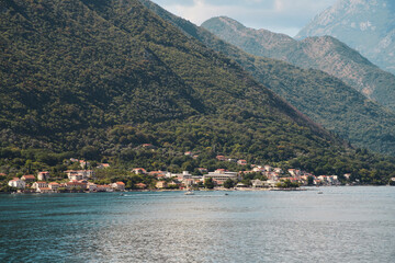 Fototapeta premium Mountain landscape with lake and cloudy sky