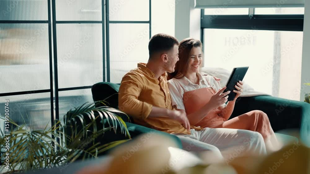 Poster couple, relax and scroll with tablet on sofa for online shopping, app choice or purchase decision. h