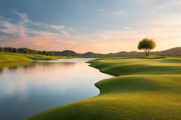 Scenic golf course view with lush green landscape and serene lake reflecting the sky. A tranquil scene for relaxation and recreation.