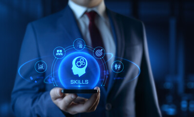 Businessman holding smartphone with Skills icons on screen - Education and E-Learning Concept
