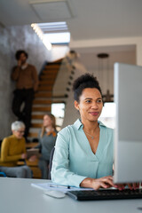 Black woman working in office and futuristic graphical user interface concept. System engineering.