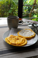Typical Costa Rican breakfast: tortilla with egg and tortilla with custard and coffee, in spanish tortilla con huevo y tortilla con natilla.