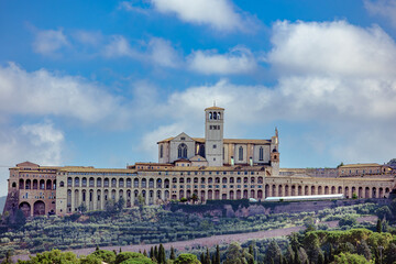 Papal Basilica of Saint Francis of Assisi showcasing stunning architecture under a clear blue sky in Umbria. Assisi, Umbria, Italy
