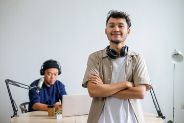 Portrait of Radio Hosts Smile and Enjoy While Record Podcast in Home Studio