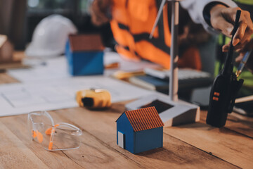 Engineers are helping to design work on blueprints and collaborate on structural analyzing of project types.