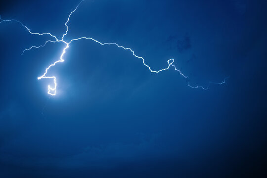lightning in the night - Powered by Adobe