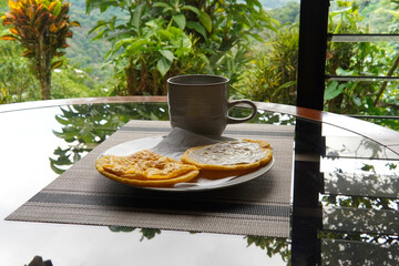 Typical Costa Rican breakfast: tortilla with egg and tortilla with custard and coffee, in spanish tortilla con huevo y tortilla con natilla.