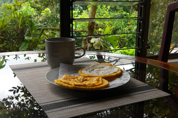 Typical Costa Rican breakfast: tortilla with egg and tortilla with custard and coffee, in spanish tortilla con huevo y tortilla con natilla.