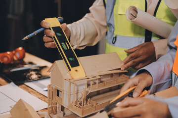 Engineers are helping to design work on blueprints and collaborate on structural analyzing of project types.