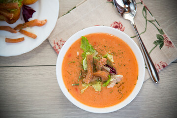 Healthy and delicate cream soup of red fish with dill