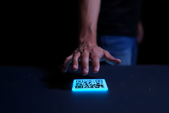 Hand reaching for a glowing blue QR code object