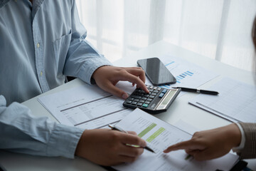 Businessmen and women are having a meeting to plan finance and investment