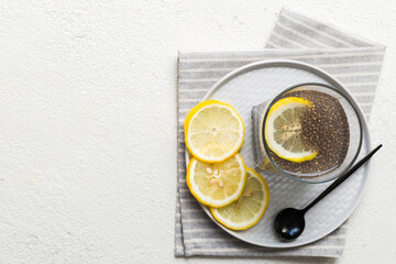 Healthy breakfast or morning with chia seeds and lemon on table background, vegetarian food, diet...