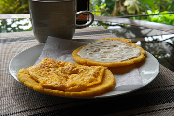 Typical Costa Rican breakfast: tortilla with egg and tortilla with custard and coffee, in spanish tortilla con huevo y tortilla con natilla.