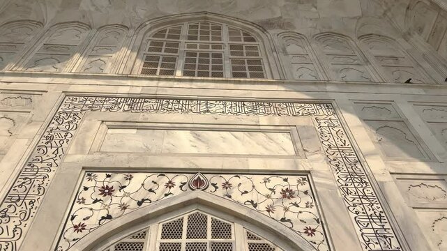 Taj Mahal Facade With Arabic Calligraphy And Plant Motifs In Agra, India. - low angle shot