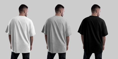 Mockup of white, heather, black oversized t-shirt on bearded man, back view, isolated on background. Streetwear set.