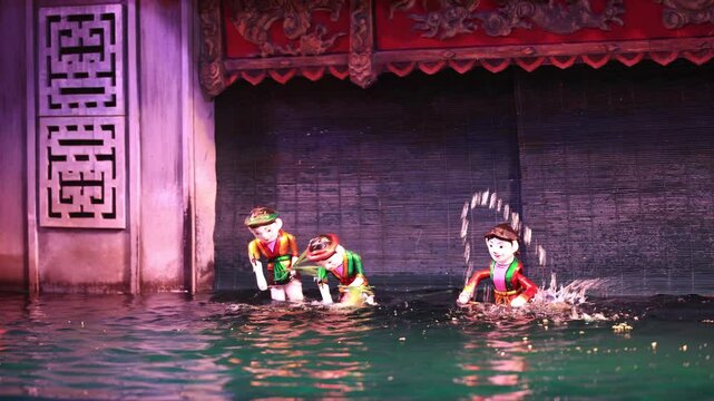 Traditional Vietnamese water puppet dolls theatre show in Hanoi, Vietnam, water puppetry doll show, in Thang Long theatre , one of the most traditional water puppet show in Hanoi, Vietnam.